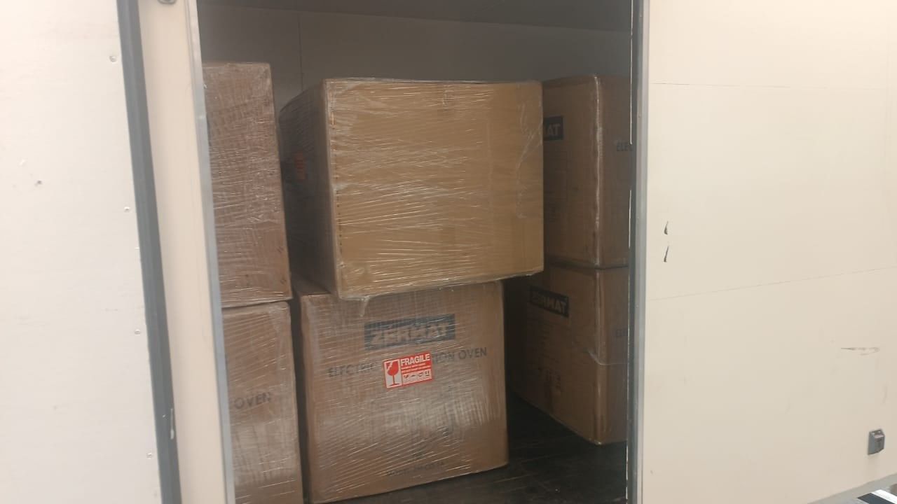 Oven cartons loaded into the lorry for transport to Port Klang