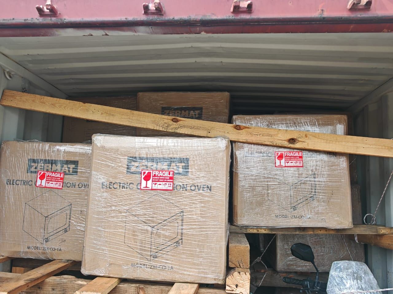 Oven cartons loaded & braced inside the container for the voyage to Sabah
