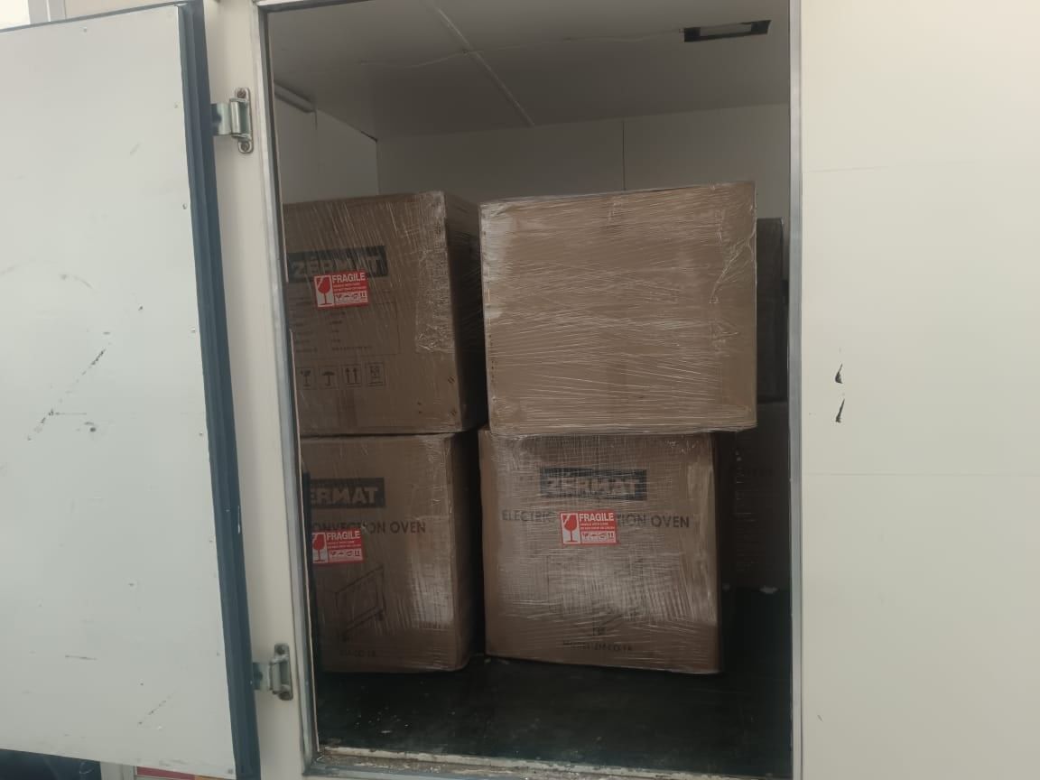 Oven cartons neatly arranged in the delivery lorry