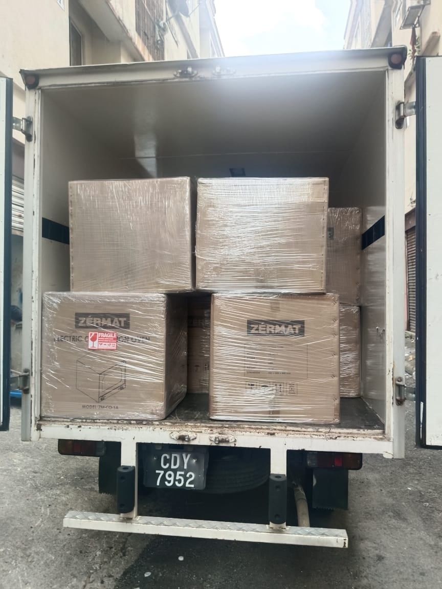 Lorry fully loaded with oven cartons, ready to depart for Port Klang